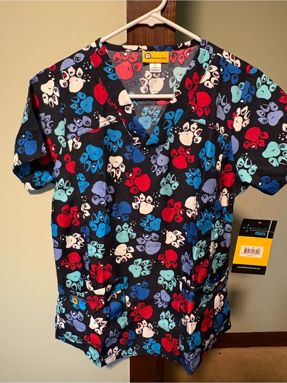 WonderWink Unisex Navy Paw Print Scrub Top with Red, Blue & Teal Accents